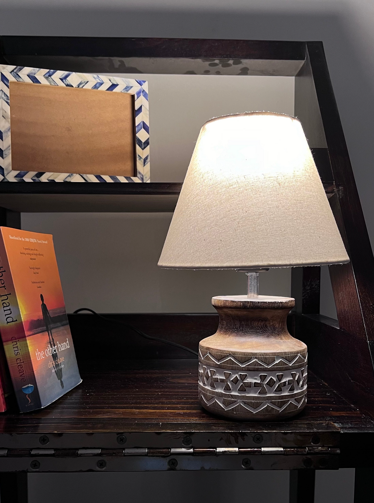 Wooden carved lamp with linen lamp cover