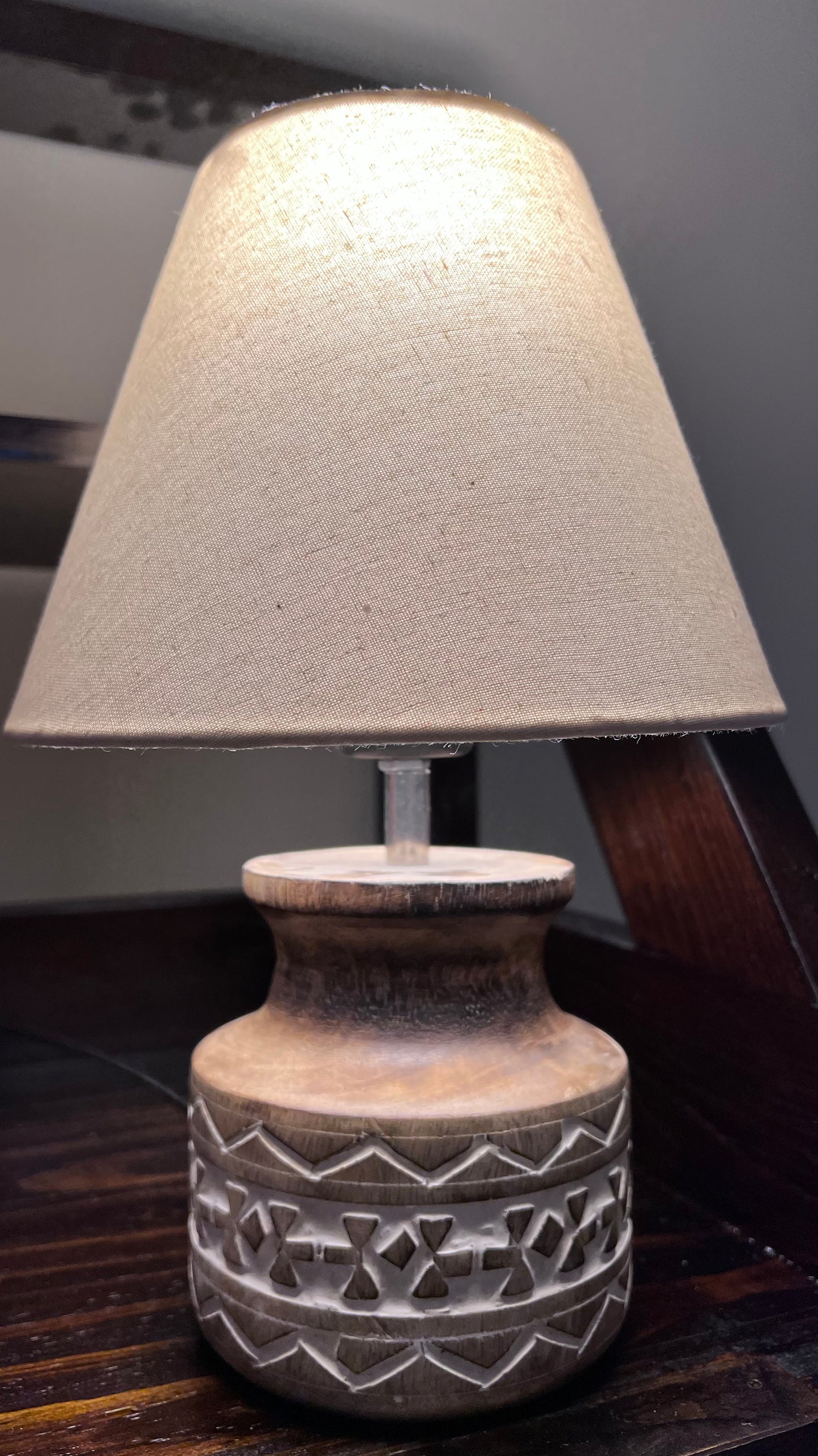 Wooden carved lamp with linen lamp cover